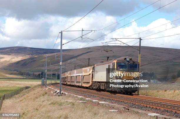 Class 92 multi-voltage electric locomotive curves through the Upper Clyde valley on the ascent of Beattock with a Mossend - Carlisle Enterprise...