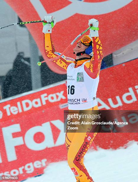 Erik Guay of Canada celebrates after winning the globe for the overall World Cup Super G during the Audi FIS Alpine Ski World Cup Men's Super G on...