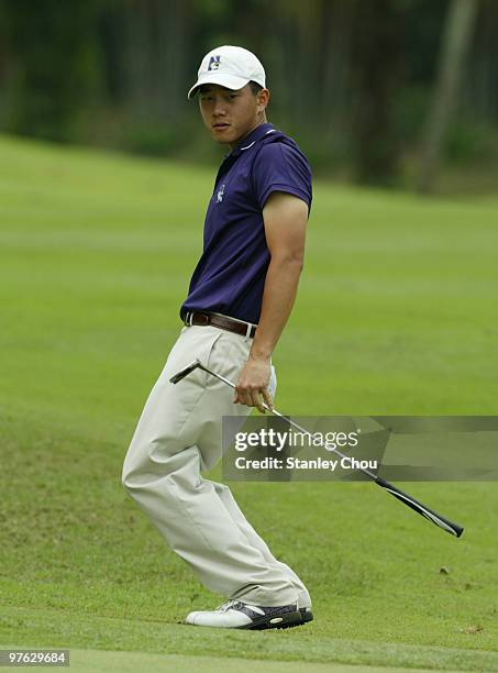 Eric Chun of South Korea reacts after missing a birdie on the 17th hole during Asian International Final Qualifying for The Open at Saujana Golf and...