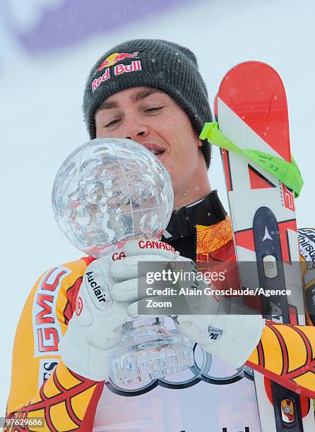 Erik Guay of Canada takes the globe for the overall World Cup Super G during the Audi FIS Alpine Ski World Cup Men's Super G on March 11, 2010 in...