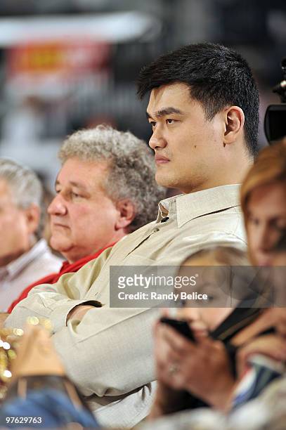 Yao Ming of the Houston Rockets watches the action courtside with Rio Grande Valley Vipers principal owner Alonzo Cantu during the Vipers NBA...