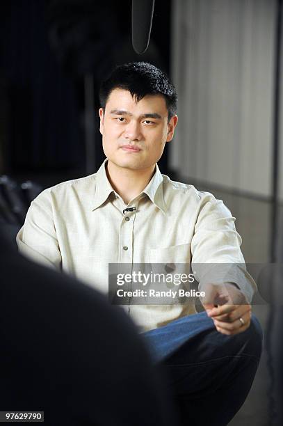 Yao Ming of the Houston Rockets contemplates his answer in Mandarin Chinese during a sit down interview with a video producer prior to the NBA...