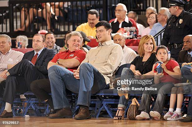 Yao Ming of the Houston Rockets shares a light moment courtside with Rio Grande Valley Vipers principal owner Alonzo Cantu during the Vipers NBA...