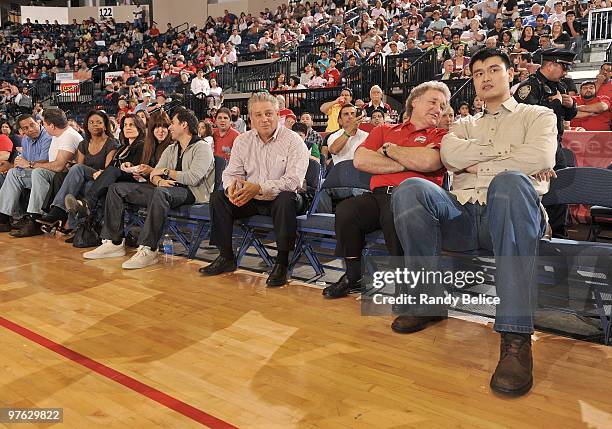 Yao Ming of the Houston Rockets watches the action courtside with Rio Grande Valley Vipers principal owner Alonzo Cantu during the Vipers NBA...