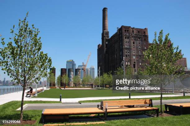 May 2018, USA, New York: The building of the former Domino Sugar Factory refinery in the newly built Domino Park is being converted into a luxury...