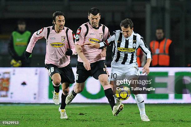 Mattia Cassani and Cesare Bovo of Palermo and Alessandro Del Piero of Juventus compete for the ball during the Serie A match between Juventus and...