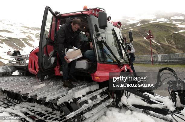 Bordeaux winemaker Franck Labeyrie unloads his boxes with wine in Cauterets, Pyrenees, southern France, on June 7, 2018. - Labeyrie has recovered his...