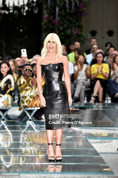 Donatella Versace acknowledges the applause of the audience at the Versace show during Milan Men's Fashion Week Spring/Summer 2019 on June 16, 2018...