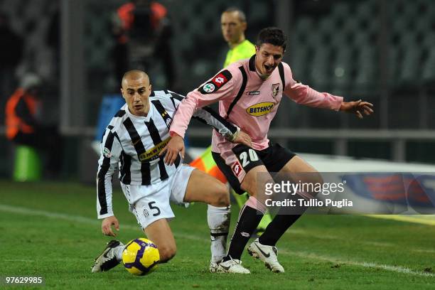 Fabio Cannavaro of Juventus and Igor Budan of Palermo compete for the ball during the Serie A match between Juventus and Palermo at Stadio Olimpico...