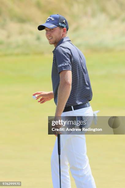 Daniel Berger of the United States waves on the 18th hole during the third round of the 2018 U.S. Open at Shinnecock Hills Golf Club on June 16, 2018...