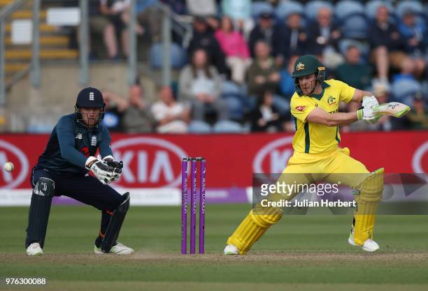 Jos Buttler of England looks on as Tim Paine of Australia scores runs during the 2nd Royal London ODI match between England and Australia at SWALEC...