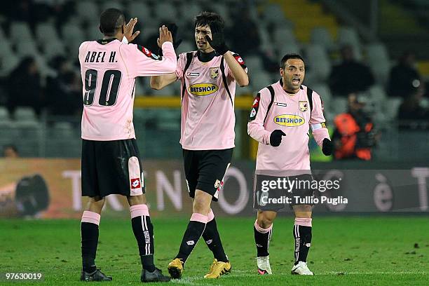 Fabrizio Miccoli of Palermo celebrates his goal with team mates Abel Hernandez and Javier Pastore during the Serie A match between Juventus and...