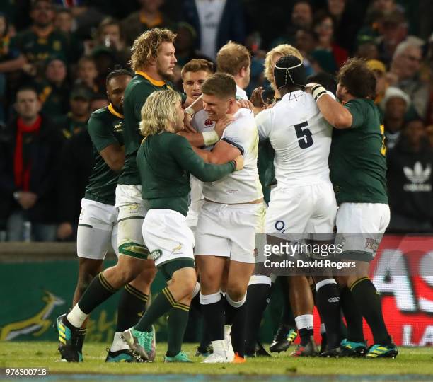 Owen Farrell, the England captain, tustles with Faf de Klerk during the second test match between South Africa and England at Toyota Stadium on June...