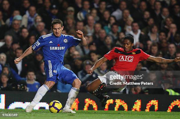 Antonio Valencia of Manchester United clashes with Frank Lampard of Chelsea during the FA Barclays Premier League match between Chelsea and...