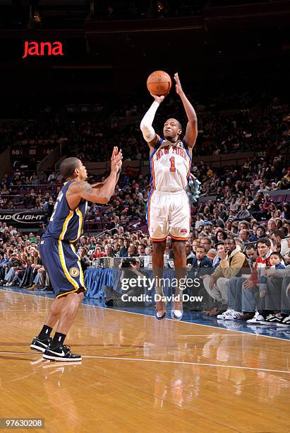 Chris Duhon of the New York Knicks shoots against Earl Watson of the Indiana Pacers during the game on January 3, 2010 at Madison Square Garden in...