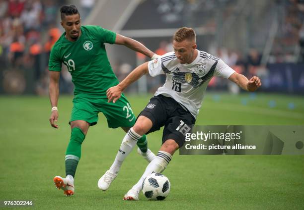 June 2018, Germany, Leverkusen: Football international friendly, Germany vs Saudi Arabia at the BayArena. Germany's Joshua Kimmich and Saudi's Salem...