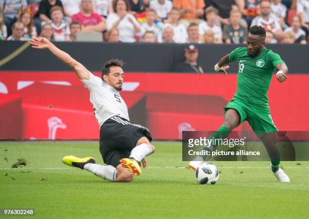 June 2018, Germany, Leverkusen: Football international friendly, Germany vs Saudi Arabia at the BayArena. Germany's Mats Hummels and Saudi's Salem...