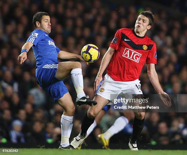 Michael Carrick of Manchester United clashes with Joe Cole of Chelsea during the FA Barclays Premier League match between Chelsea and Manchester...