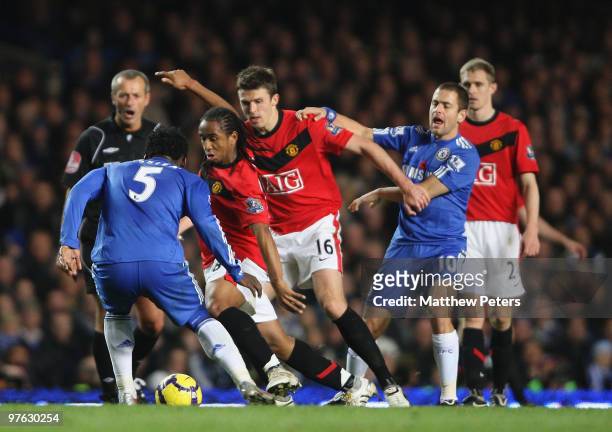Anderson of Manchester United is challenged by Michael Essien of Chelsea during the FA Barclays Premier League match between Chelsea and Manchester...