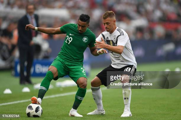 June 2018, Germany, Leverkusen: Soccer, international, Germany vs Saudi Arabia at the BayArena. Germany's Joshua Kimmich and Saudi's Salem...