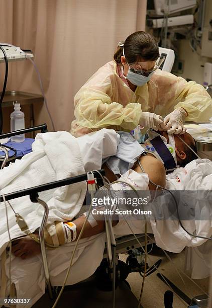 Member of the trauma team at the John H. Stroger Jr. Cook County Hospital try to save the life of a man who was hit by a car November 6, 2009 in...