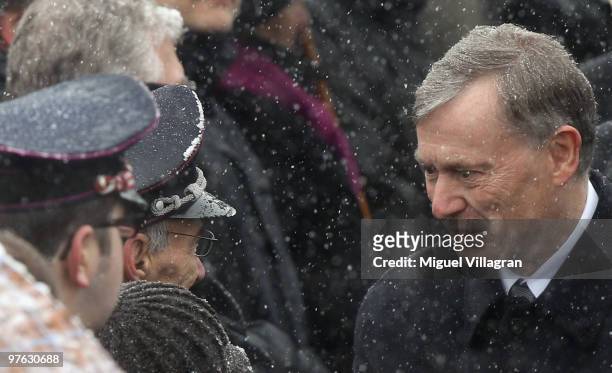 German President Horst Koehler talks to an fire fighter during a commemoration ceremony in front of the Albertville School on March 11, 2010 in...