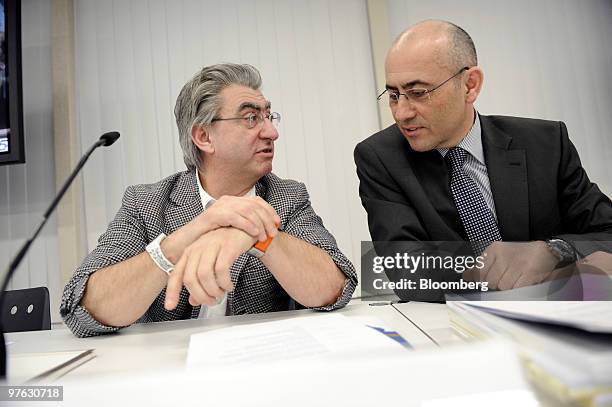 Nick Hayek Jr, chief executive officer of Swatch Group AG, left, speaks with Thierry Kenel, chief financial officer of Swatch Group AG, during the...