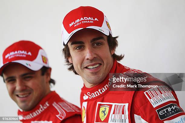 Fernando Alonso of Spain and Ferrari and his team mate Felipe Massa of Brazil and Ferrari attend the drivers official portrait session during...