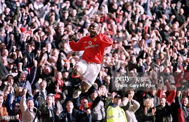 Dwight Yorke of Man Utd celebrates after scoring the second goal during the Manchester United v Arsenal FA Carling Premiership match at Old Trafford,...