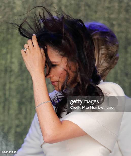 Meghan, Duchess of Sussex's hair is blown in the wind as she attends a ceremony to open the new Mersey Gateway Bridge on June 14, 2018 in Widnes,...