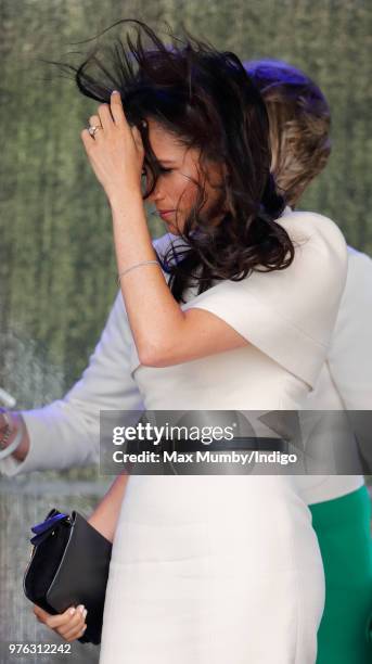 Meghan, Duchess of Sussex's hair is blown in the wind as she attends a ceremony to open the new Mersey Gateway Bridge on June 14, 2018 in Widnes,...
