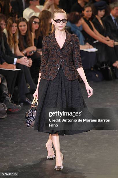 Model walks the runway during the Louis Vuitton Ready to Wear show as part of the Paris Womenswear Fashion Week Fall/Winter 2011 at Cour Carree du...