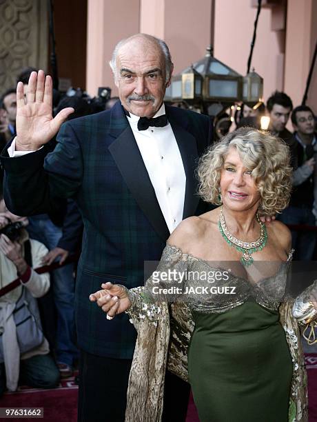 Scottish actor Sean Connery and his wife, Micheline Roquebrune, arrive for the presentation of "Alexendre," directed by Oliver Stone, during the 44th...