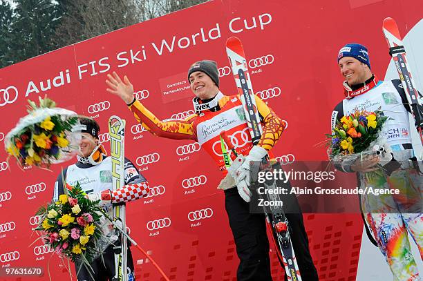 Erik Guay of Canada takes the globe for the overall World Cup Super G during the Audi FIS Alpine Ski World Cup Men's Super G on March 11, 2010 in...