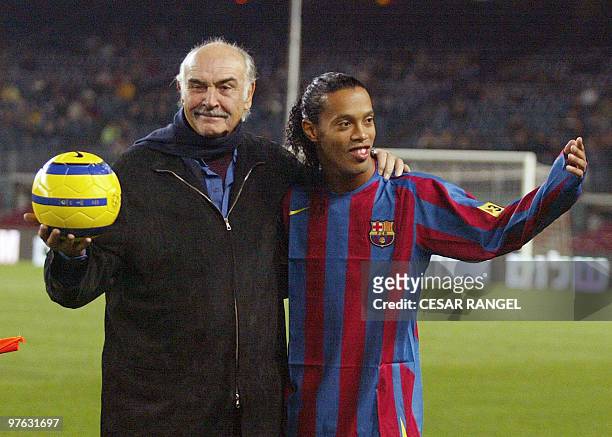 British actor Sean Connery stands with Brazilian player Ronaldinho after making a ceremonial kick off during "Match for Peace " at the Camp Nou...