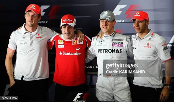 Former F1 world champions McLaren Mercedes' British driver Lewis Hamilton, Mercedes GP's German driver Michael Schumacher and Ferrari's Spanish...