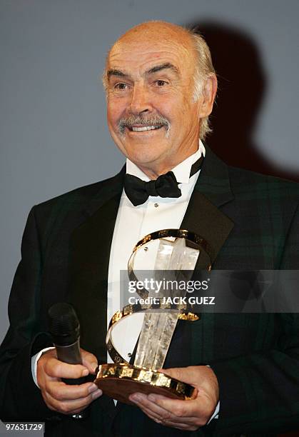 Scottish actor Sean Connery stands on stage after the 4th International Film Festival awarded him with a Golden star homage award in Marrakesh, 07...