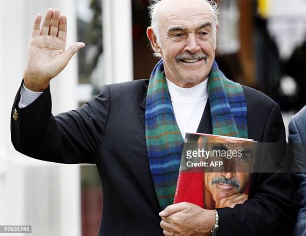 Scottish screen legend Sir Sean Connery poses for photographers as he promotes his new book, called 'Being a Scot' at the Edinburgh International...