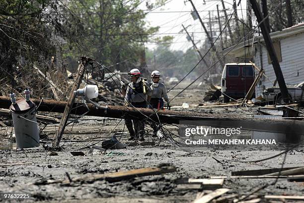 Members of the Miami Task Force do a house-to-house search in a devastated neighborhood of eastern New Orleans 21 Septembe, 2005. Authorities have...