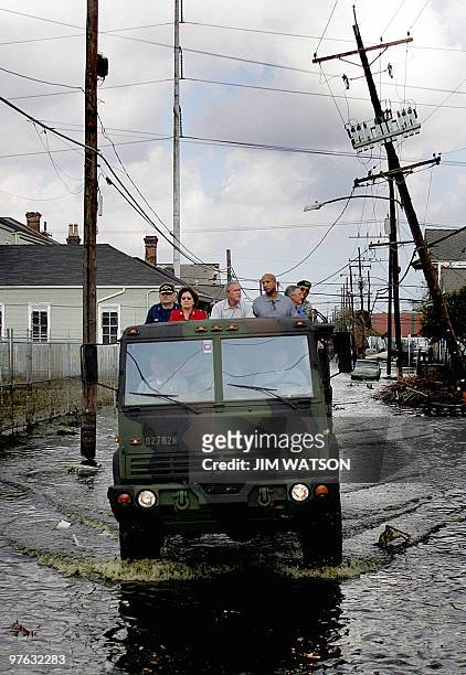 Vice Admiral Thad Allen , Louisiana Governor Kathleen Blanco , US President George W. Bush and New Orleans Mayor Ray Nagin drive through a devastated...