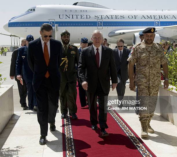 Defence Secretary Robert Gates walks with US Ambassador to the UAE Richard Olson and Emirati Deputy Chief of Staff, Major General Ali al-Kaabi , upon...