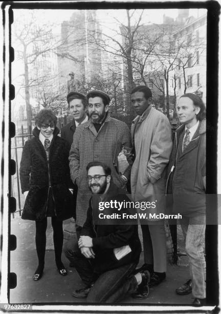 Group portrait of writers for the Village Voice newspaper as thet pose in Sheridan Square Park, near the paper's offices, New York, New York,...