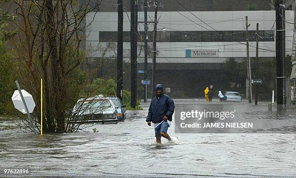 Man wades through high water 29 August 2005 in New Orleans, after Hurricane Katrina made landfall near the Louisiana metroplis. Hurricane Katrina...