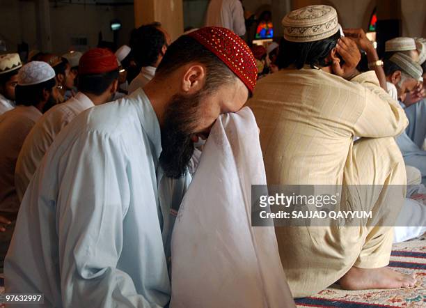 Pakistani man weeps as he listens to a sermon by Red Mosque chief cleric Maulana Abdul Aziz during Friday prayers in Islamabad on July 10 the second...