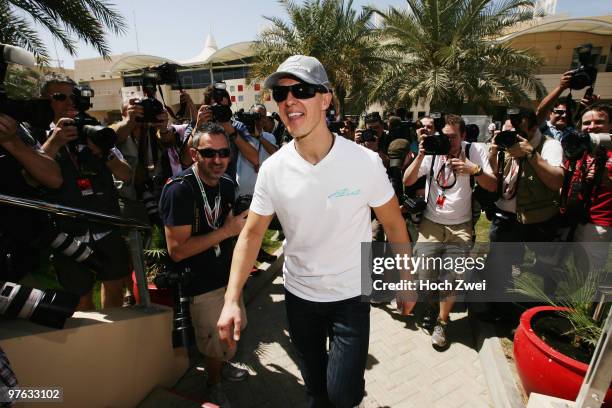 Michael Schumacher of Germany and Mercedes GP walks in the paddock during previews to the Bahrain Formula One Grand Prix at the Bahrain International...