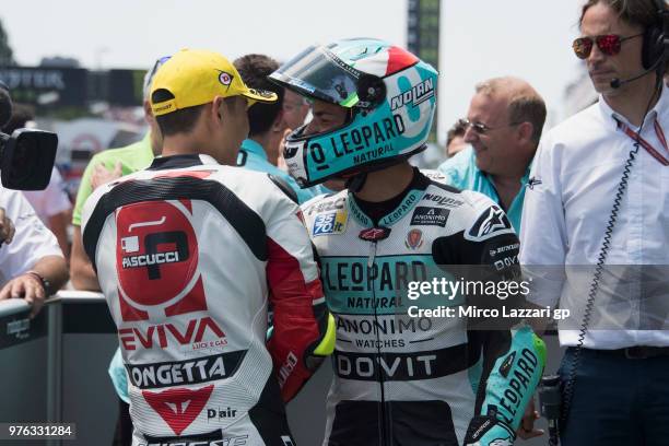 Enea Bastianini of Italy and Leopard Racing celebrates with Tatsuki Suzuki of Italy and Sic 58 Squadra Corse at the end of the qualifying practice...