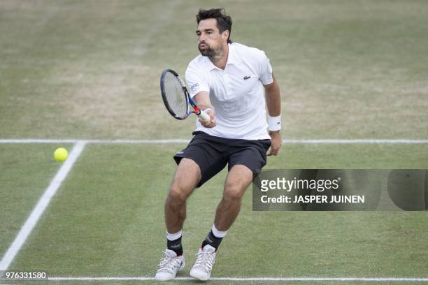 Jeremy Chardy of France returns a ball against Matthew Ebden of Australia during the semi finals of the men's singles match at the Libema Open Tennis...