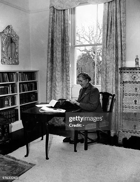 English writer Dame Agatha Christie, at work on a typewriter in March 1946 in her home, Greenway House, in Devonshire. Agatha Christie, born Miller...