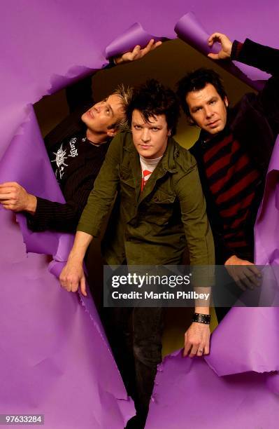 Andy Strachan, Chris Cheney and Scott Owen of The Living End pose for a studio portrait at Sing Sing Studio on 11th August 2004 in Melbourne,...