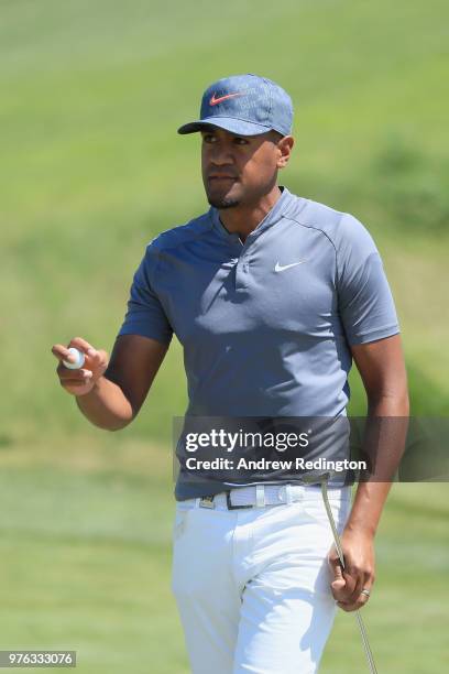 Tony Finau of the United States celebrates after making a birdie putt on the 18th green during the third round of the 2018 U.S. Open at Shinnecock...
